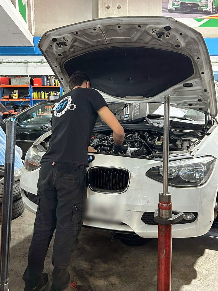 Mechanic working on a car engine